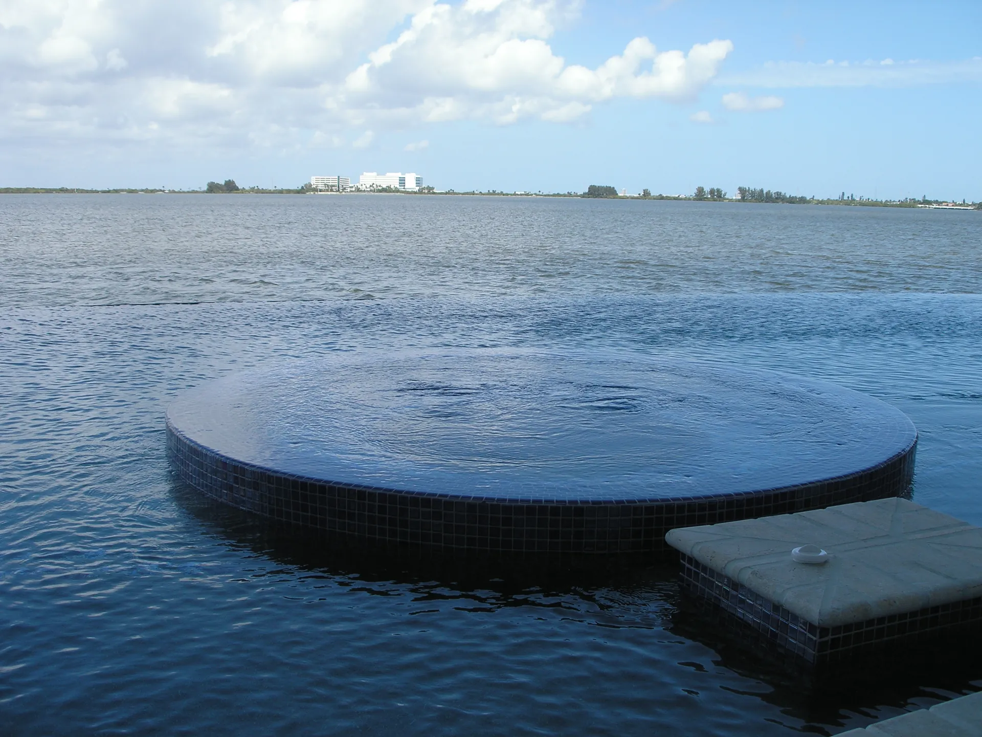 Home 4 Perimeter overflow spa flush with an infinity pool over the Indian River lagoon